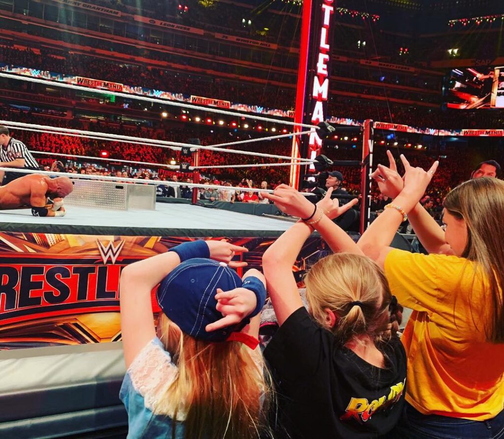 Aurora with her siblings watching their father wrestle - Thrill NG