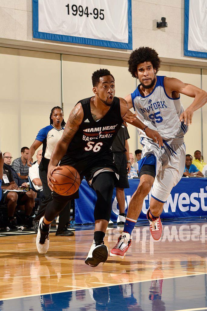 Juwan Howard Jr. 56 of Miami Heat drives to the basket during the game against Louis Labeyrie 95 of New York Knicks - Thrill NG