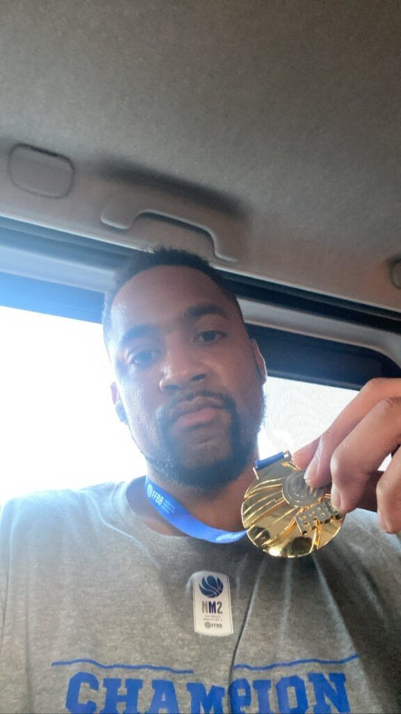 Juwan Howard Jr. showing off his FFBB award medal