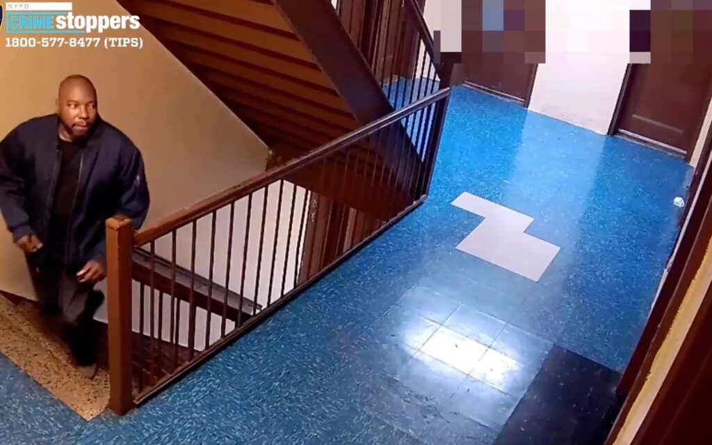 Jason Pass walking upstairs to Bladimy Muthurin apartment