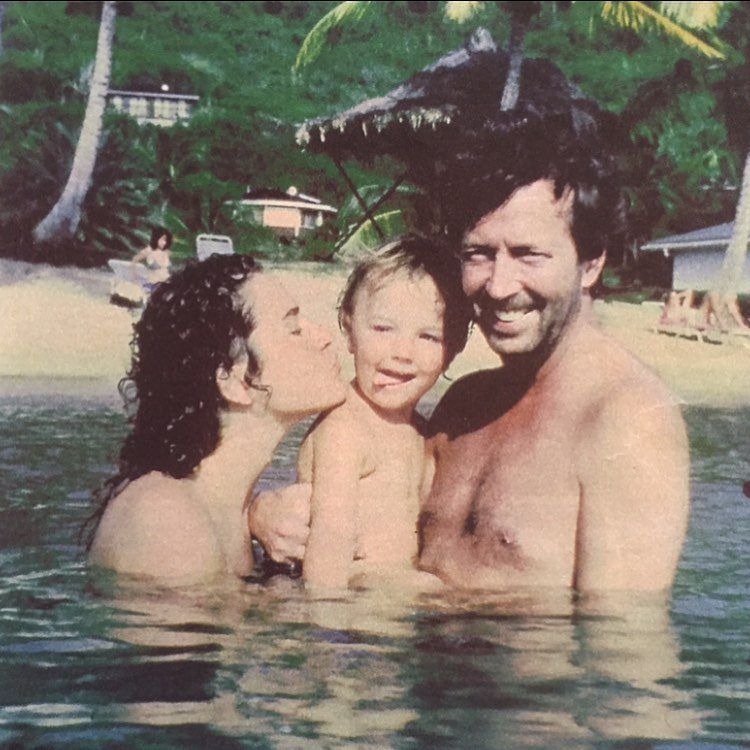 Conor Clapton with his parents in the water