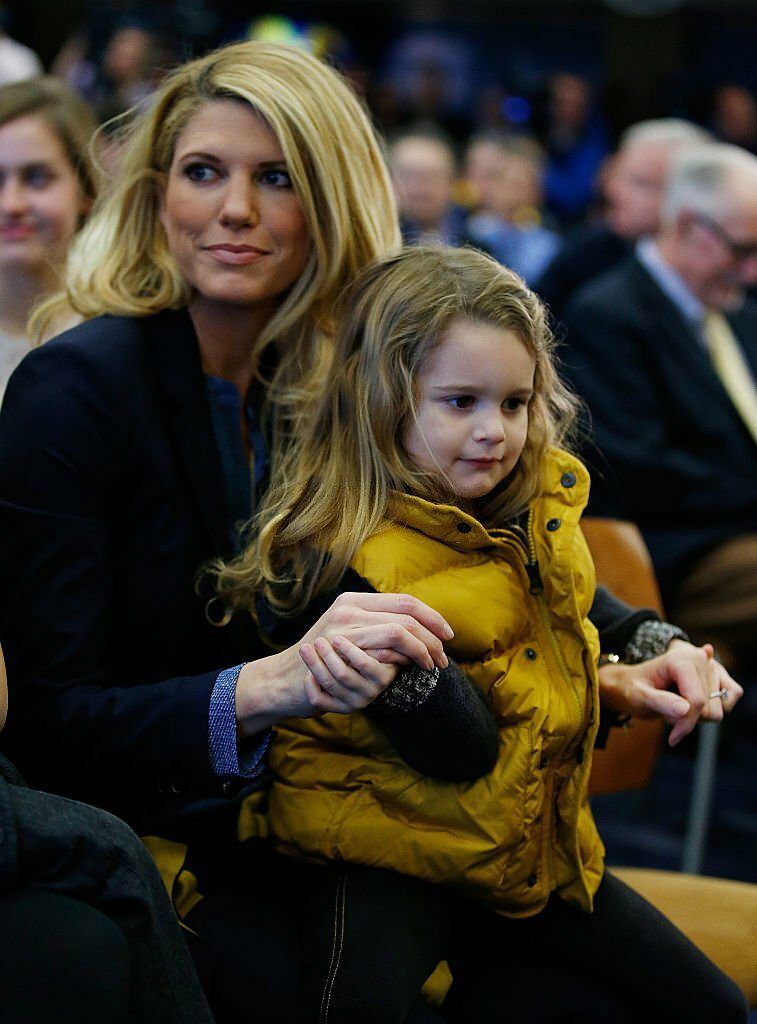 Sarah Harbaugh sits with daughter Katherine prior to Jim Harbaugh being introduced as the new Head Coach of the University of Michigan football team.